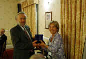 Derek Wright, former Chairman, receiving engraved tankard.